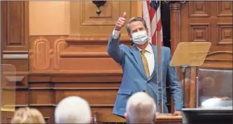  ?? AP-John Bazemore ?? Georgia Gov. Brian Kemp gestures to lawmakers after delivering his State of the State address in the House Chambers in Atlanta on Jan. 14.