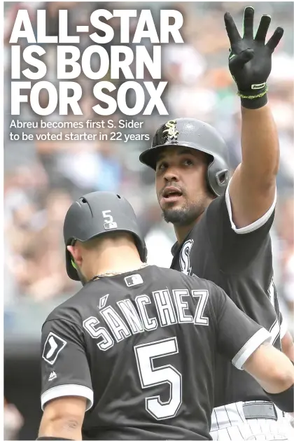  ?? JONATHAN DANIEL/ GETTY IMAGES ?? No one in the White Sox’ locker room commands more respect than Jose Abreu ( with Yolmer Sanchez).