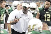  ?? LYNNE SLADKY / ASSOCIATED PRESS ?? South Florida coach for the past four seasons, Willie Taggart led the Bulls from a 2-10 record in his first year to 10-2 and a berth in the Birmingham Bowl this year.
