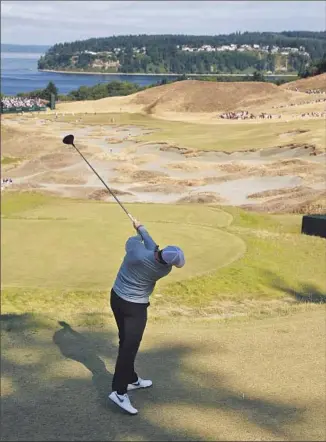  ?? Charlie Riedel
Associated Press ?? THIS IS WHAT the No. 1 golfer in the world, Rory McIlroy, faced on the 14th tee at Chambers Bay during a practice round. The course, which opened in 2007, could play as long as 7,800 yards.
