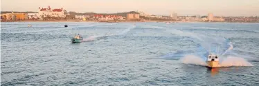  ??  ?? OUT TO SEA: Skiboats head out to sea to take part in a national angling competitio­n in Algoa Bay