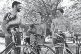  ?? VANESSA TIGNANELLI, RECORD STAFF ?? Sam Nabi, left, Alex Szaflarska and Sean Campbell’s new cycling and folk music festival will celebrate the region’s countrysid­e line and protect farmlands by encouragin­g a lifestyle that includes biking to St. Jacob’s for fresh flowers.