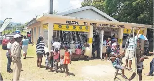  ??  ?? Community members of Rose Heights wait to access medical services during The SJF-funded Back-to-School Health and Informatio­n Fair in St James.