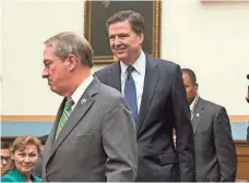  ?? DREW ANGERER, GETTY IMAGES ?? Rep. Bob Goodlatte and FBI chief James Comey arrive Tuesday for a House committee hearing on encryption and privacy.