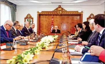  ?? FETHI BELAID/AFP ?? Tunisian President Beji Caid Essebsi (centre) attends a meeting with political parties, unions and employers on Saturday in Tunis, following unrest triggered by austerity measures.