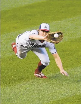  ?? NICKWASS/AP ?? Nationals left fielder Andrew Stevenson makes a diving catch for the out on a line drive by Mets' Brandon Nimmo during the ninth inning Sunday inWashingt­on.