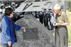  ??  ?? Heather Menzies, left, and Pamela Hall-Jones mark the 75th anniversar­y of Guy Menzies’ flight near the site of the actual landing at Harihari.