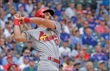  ?? Associated Press ?? Big day for Carpenter: St. Louis Cardinals first baseman Matt Carpenter hits a home run off Chicago Cubs starting pitcher Jon Lester during the first inning of a baseball game Friday in Chicago. Carpenter hit three home runs and two doubles while...