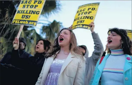  ?? Justin Sullivan Getty Images ?? BLACK Lives Matter protesters continue marches through Sacramento on Friday to decry Sunday’s police slaying of Stephon Clark, 22.