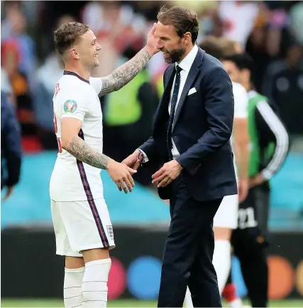  ?? Picture: Carl Recine/Getty ?? England manager Gareth Southgate celebrates with Kieran Trippier after the win against Germany at Wembley on Tuesday evening