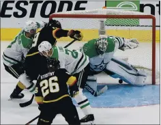  ?? JASON FRANSON — THE ASSOCIATED PRESS ?? Dallas Stars goalie Anton Khudobin barely keeps the puck out of the net in Monday night’s Western Conference finals Game 5 win over the Knights.