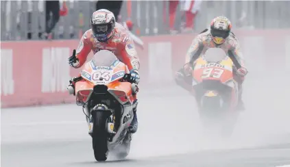  ??  ?? STUNNER. Ducati’s Andrea Dovizioso of Italy celebrates as he beats world champion Marc Marquez of Spain at the Japanese MotoGP at Twin Ring Motegi circuit yesterday.