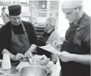  ??  ?? Chef Daniel Vézina, left, works with members Francine Bélanger centre, and Marc-André Jolivet.