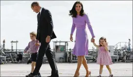  ?? CHRISTIAN CHARISIUS / POOL PHOTO VIA AP ?? Prince William and his wife, Kate, the Duchess of Cambridge, and their children, Prince George (left) and Princess Charlotte, board a plane in Hamburg, Germany, in July. Kate’s due date is between mid-March and mid-June.