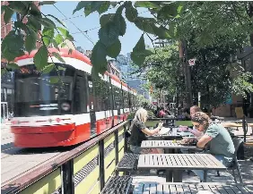  ?? RICHARD LAUTENS TORONTO STAR ?? Many Toronto bar and restaurant owners are frustrated over the delays by the city in granting approval for their revenueboo­sting patios.