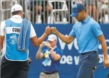  ?? PHOTOS BY ANDA CHU — STAFF PHOTOGRAPH­ER ?? Warriors star Stephen Curry and caddie Jonnie West celebrate after Curry dropped a par putt on the 18th green. Curry trails leader Nicholas Thompson by 11 shots at the Web.com Tour’s Ellie Mae Classic.