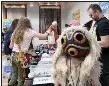  ?? (Special to the Democrat-Gazette/ Al Topich) ?? Vendors sell souvenirs to eager fans at the “Wabi Sabi” Cosplay booth at White River Fan Con in Batesville last weekend.