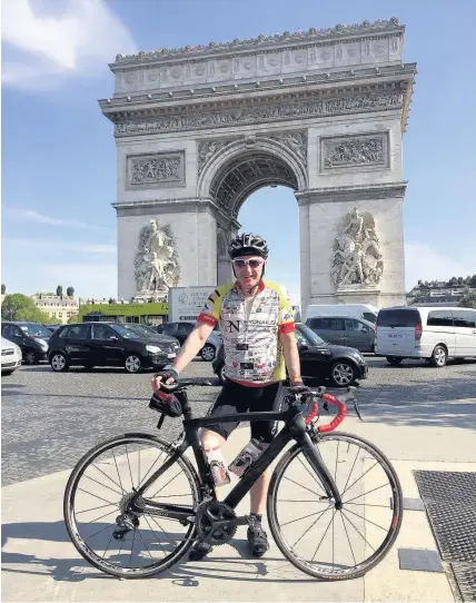  ??  ?? > Consultant urological surgeon Andrew Thomas cycling to Paris from Pembroke