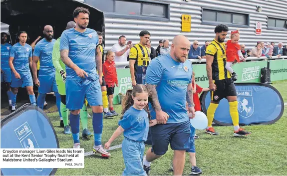  ?? PAUL DAVIS ?? Croydon manager Liam Giles leads his team out at the Kent Senior Trophy final held at Maidstone United’s Gallagher Stadium