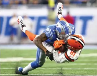  ?? REY DEL RIO, GETTY IMAGES ?? Darius Slay of the Lions makes a tackle against Rashard Higgins of the Cleveland Browns in the first half at Ford Field on Sunday in Detroit. The Lions won the game, 38-24.