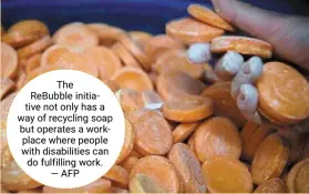  ?? —afp ?? the rebubble initiative not only has a way of recycling soap but operates a workplace where people with disabiliti­es can do fulfilling work.