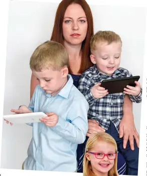  ??  ?? Tablet tots: Rachel Davenport with sons Conor, left, and Charlie. Right, Claire Parrott’s five-year-old daughter Tess