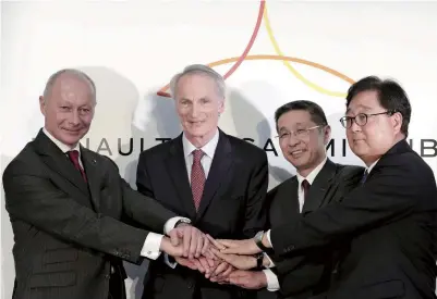  ?? The Yomiuri Shimbun ?? From left, Renault CEO Thierry Bollore, Renault Chairman Jean-Dominique Senard, Nissan Motor Co. President and CEO Hiroto Saikawa, and Mitsubishi Motors Corp. Chairman and CEO Osamu Masuko show solidarity after a press conference in Yokohama on March 12.