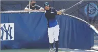  ?? Kathy Willens / Associated Press ?? Yankees DH/ OF Giancarlo Stanton swings during a July 5 workout in New York.