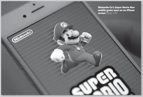  ??  ?? Nintendo Co’s Super Mario Run mobile game seen on an iPhone screen