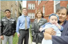  ?? | SUN- TIMES FILE PHOTO ?? Sheriff Tom Dart stands with tenants of 4914 N. Spaulding in front of the building in 2008. The building was at the center of businessma­n Catalin Stoian’s scheme.