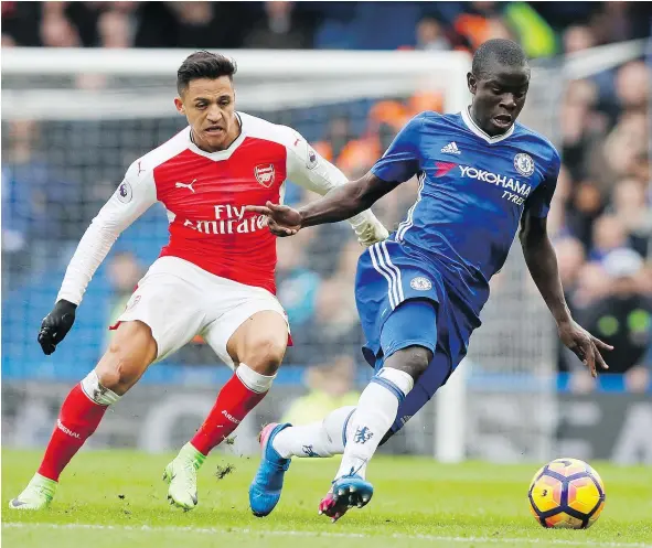  ?? — AP FILES ?? Chelsea’s N’Golo Kante, right, holds off the challenge of Arsenal’s Alexis Sanchez Feb. 4 during an EPL match at Stamford Bridge in London. Kante was a big reason Leicester won its stunning Premier League crown last season, but now he’s starring for...