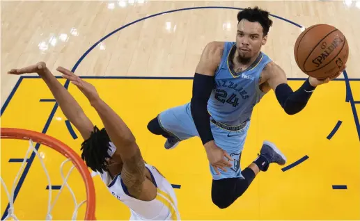  ?? (Reuters) ?? Memphis Grizzlies guard Dillon Brooks (24) shoots the basketball against Golden State Warriors guard Damion Lee (1) during the second half at Oracle Arena Monday night.