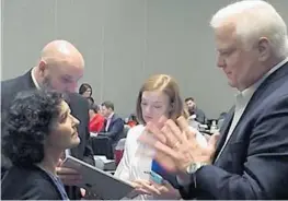  ?? ANTHONY MAN/STAFF ?? Florida Secretary of State Ken Detzner speaks with Maria Matthews, director of the state elections division, at a conference in Fort Lauderdale on Wednesday.