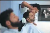  ?? AAMIR QURESHI / AGENCE FRANCE-PRESSE ?? A customer gets a haircut at the ‘Men’s’ salon in Islamabad, Pakistan. The country has seen an increase in male beauty regimes.