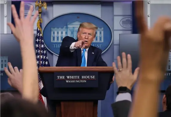  ?? (Getty) ?? Donald Trump speaks to reporters after a meeting of the coronaviru­s task force in April