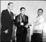  ??  ?? Omo Olivier, CEO Asia Division of MIKI Travel and Danilo Intong, Undersecre­tary of Tourism are shown presenting the award to Banatin (center).