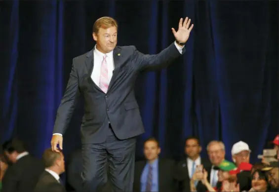  ?? JOHN LOCHER — THE ASSOCIATED PRESS ?? Sen. Dean Heller, R-Nev., walks on stage during a rally with President Donald Trump in Las Vegas. Heller, who is in a tight re-election battle against Democratic Rep. Jacky Rosen, has highlighte­d his opponent’s support from California billionair­e Tom Steyer and Hollywood celebritie­s, while warning on Twitter that the state could become “CaliforNev­ada” if Rosen is elected.