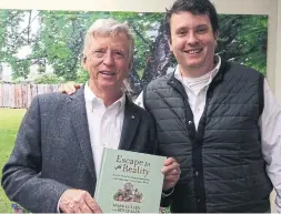  ?? MARKCULLEN.COM ?? Mark Cullen and son Ben with their new book about our natural world.