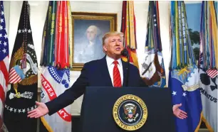 ?? (Jim Bourg/Reuters) ?? US PRESIDENT Donald Trump makes a statement at the White House yesterday following reports that US Special Forces targeted Islamic State leader Abu Bakr al-Baghdadi (right) in northern Syria.