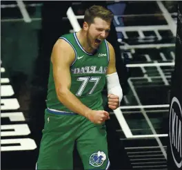  ?? KYUSUNG GONG — THE ASSOCIATED PRESS ?? Dallas Mavericks guard Luka Doncic celebrates his basket during a 124-73 rout of the Los Angeles Clippers on Sunday. Doncic scored 24 points in Los Angeles.