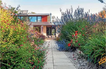  ?? PHOTO: JULIET NICHOLAS ?? The house faces north and is designed with large expanses of glass and internal heat sinks to make it energy efficient.