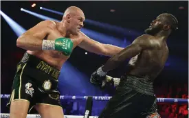  ?? FOTO: AL BELLO/LEHTIKUVA-AFP ?? ■ Teyson Furys och Deontay Wilders VM-titelmatch flyttas.