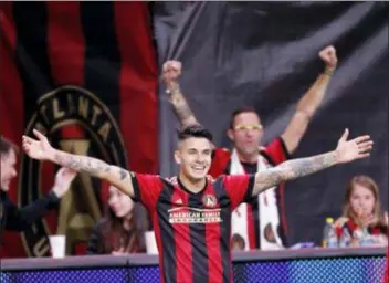  ?? JOHN BAZEMORE — THE ASSOCIATED PRESS ?? Atlanta United defender Franco Escobar celebrates after scoring a goal in the second half of Sunday’s 3-0 playoff victory over the New York Red Bulls.