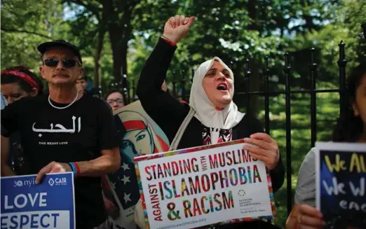  ??  ?? A rally for Muslim rights in New York. The ratio of negativeto-positive opinions of region’s immigrants is about 2 to 1 in the US