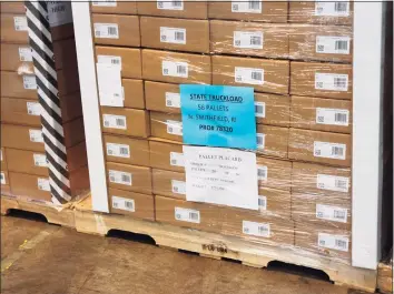  ?? Christine DeRosa / Hearst Connecticu­t Media ?? Early Friday, 426,000 at-home COVID tests were delivered to a state warehouse. Some boxes of tests were labeled for other states, including Rhode Island and New York, which Gov. Ned Lamont did not explain.