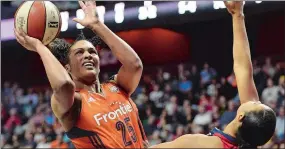  ??  ?? Connecticu­t’s Alyssa Thomas (25) shoots over Washington’s Natasha Cloud during Saturday’s game at Mohegan Sun Arena. Thomas was named WNBA Eastern Conference Player of the Week on Monday.