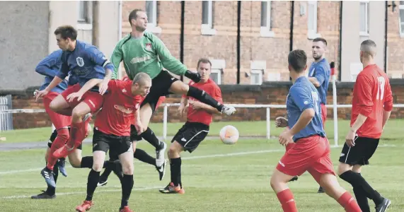  ??  ?? Action from Horden CW’s Monkwearmo­uth Charity Cup win over Darlington Town.