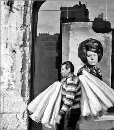  ??  ?? A Lebanese man walks in front of the yellow house in Beirut.