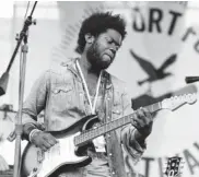  ??  ?? Michael Kiwanuka ( from left) and The Spirit Family Reunion perform at the 54th edition of the Newport Folk Festival in Newport on Sunday. —