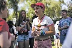  ??  ?? Emma Gonzalez, a former student at Marjory Stoneman Douglas High School in Parkland, Fla., speaks to a young activist Wednesday at the event.